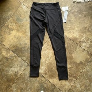 Black Kyodan leggings with mesh cutouts.